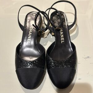 Authentic Chanel black slingback with low heel.